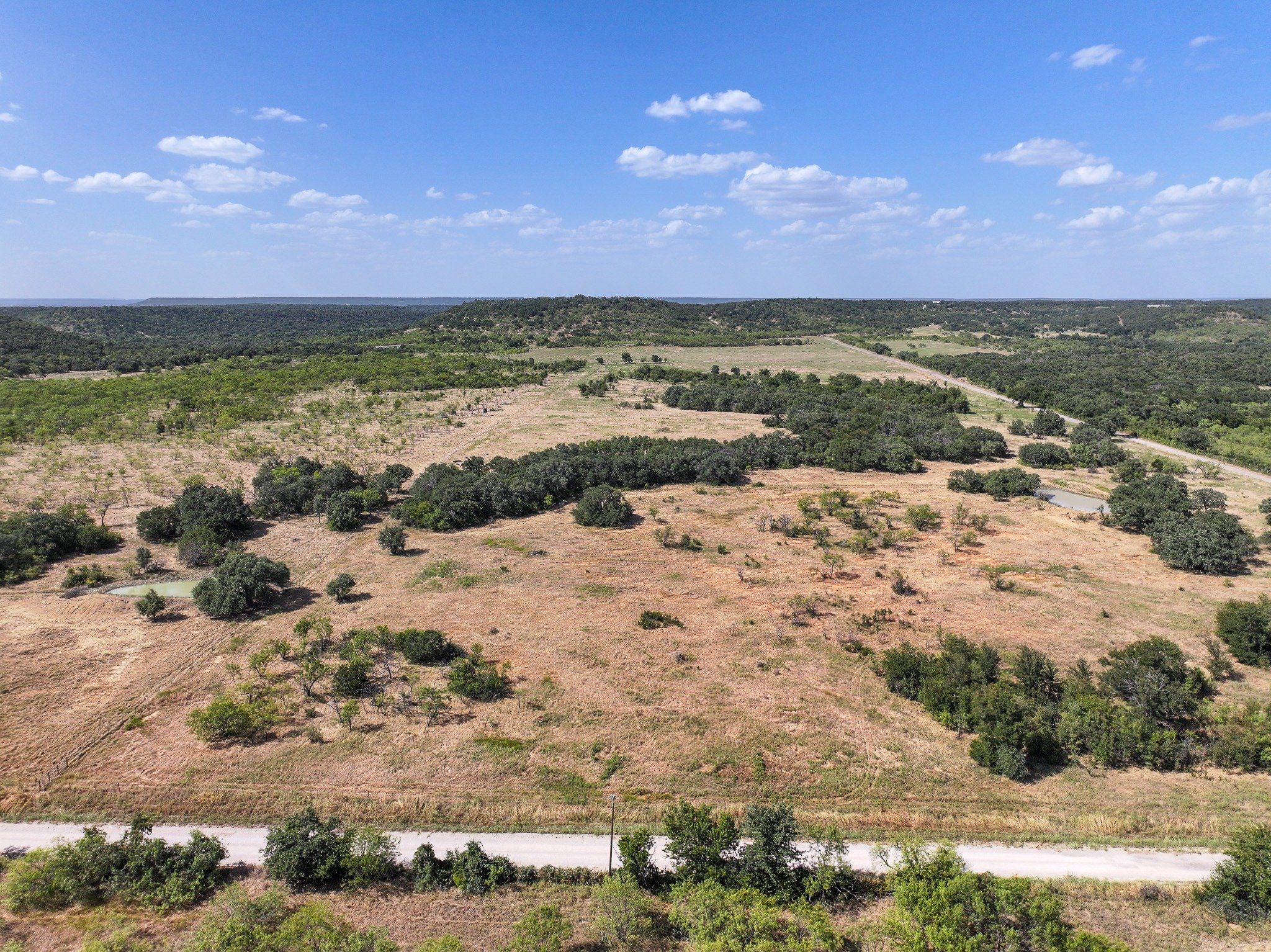 Pasture, trees and ponds