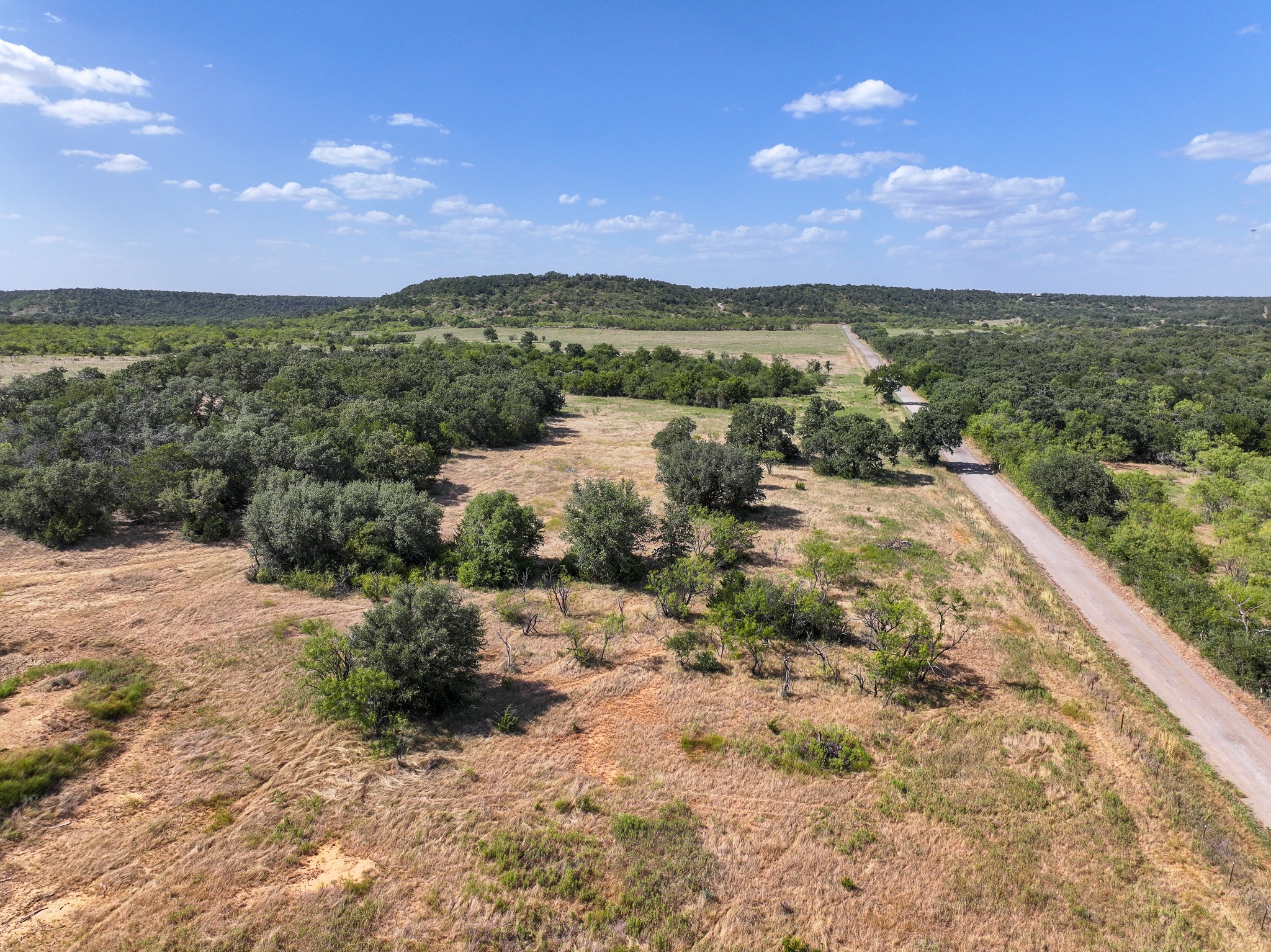 Aerial perspective of the land and road.