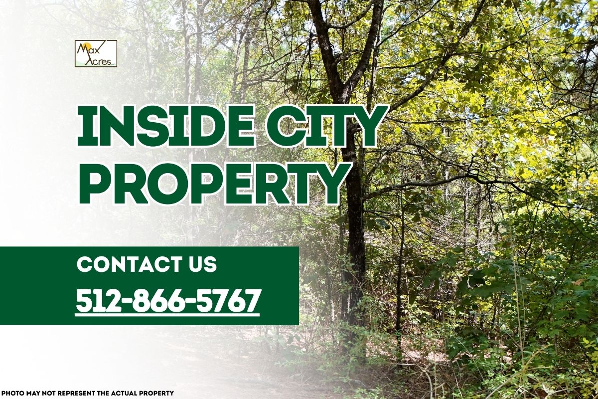 Wooded land within city limits with text overlay reading "Inside City Property – Contact 512-866-5767" by Max Acres.