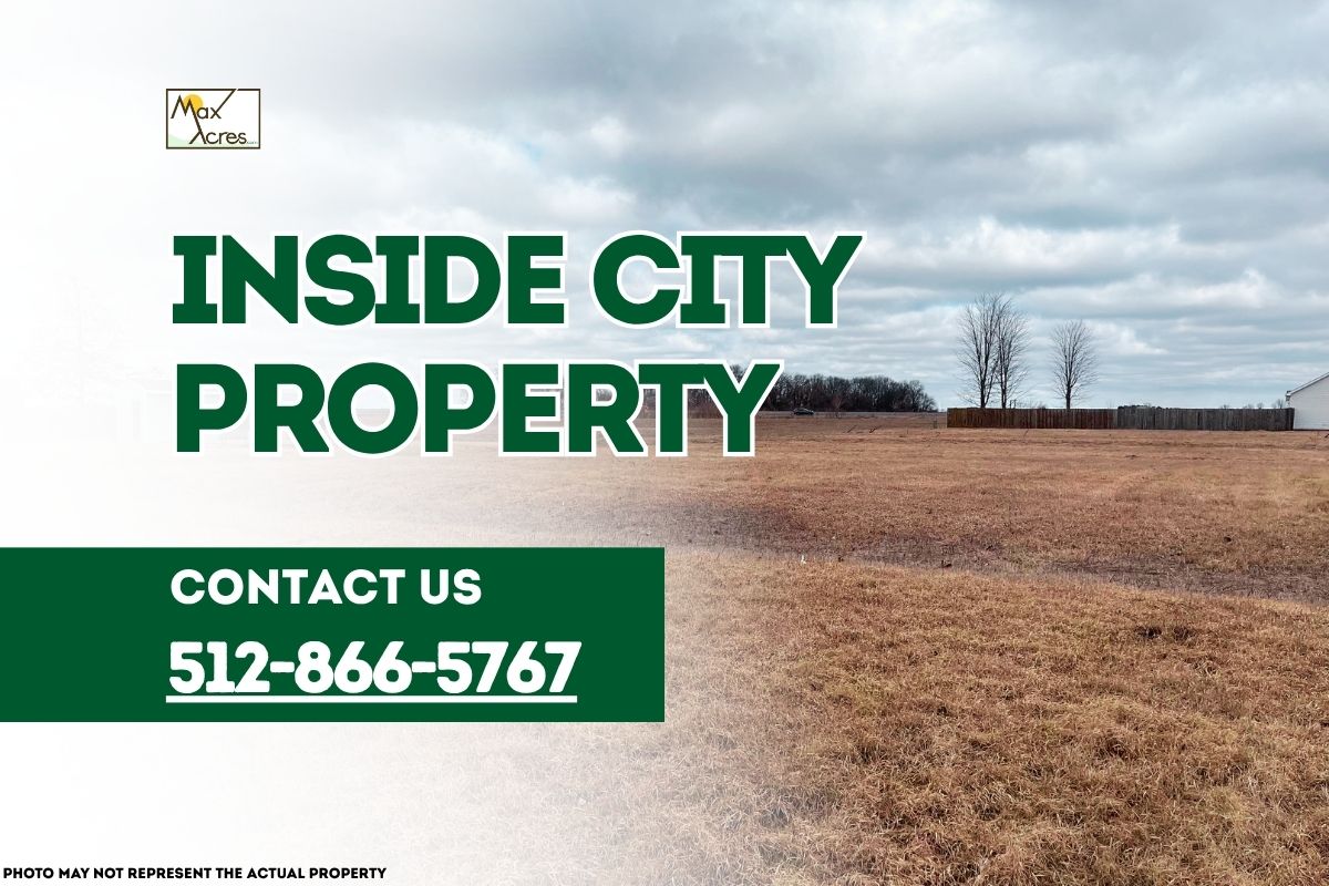 Wooded land within city limits with text overlay reading "Inside City Property – Contact 512-866-5767" by Max Acres.
