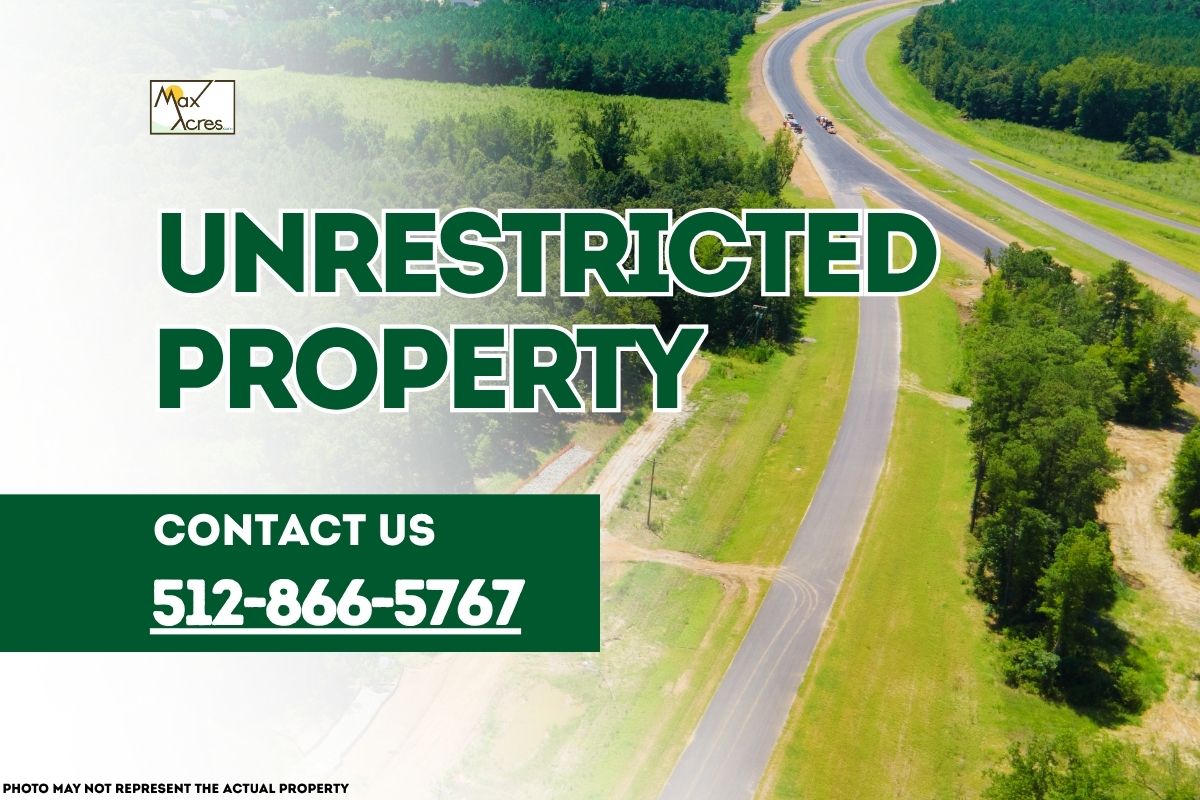 Aerial view of open green land and road with text overlay reading "Unrestricted Property – Contact 512-866-5767" by Max Acres.